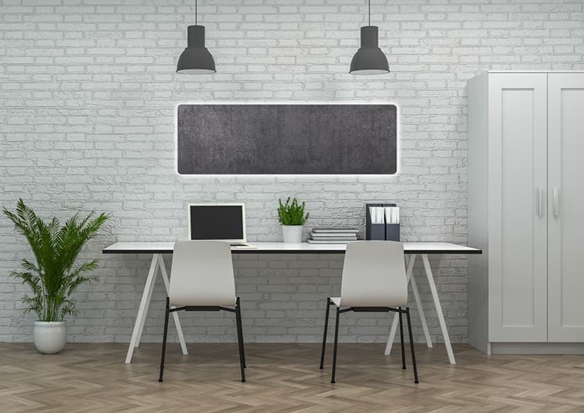 Modernes Büro mit weißer Ziegelmauer, zwei Arbeitsplätzen und schwarzen Pendelleuchten